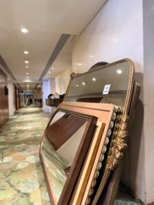 One photo shows mirrors staged in a corridor—frames, finishes, and profiles lined up and ready to be reviewed. 
