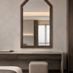 Installed above a contemporary suite console, the Chamfered Walnut Portico Mirror adds warmth and architectural identity to an urban hospitality interior.