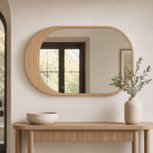 Reeded oak horizontal mirror above a modern entryway console