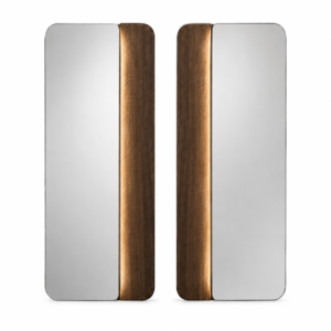 A matched pair of hotel bedside mirrors with outward mirror panels, inward-facing smoked-oak wings, deep-bronze reveals, and softly illuminated inner edges.