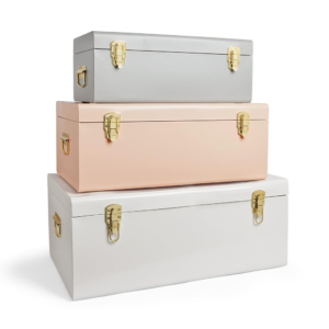 Private-label storage trunks in pastel colors with gold-tone hardware for customization businesses