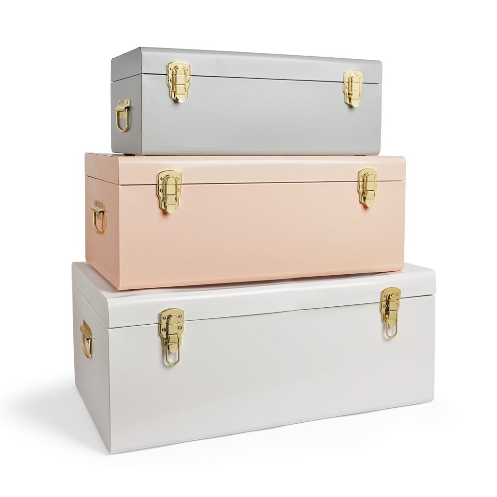 Private-label storage trunks in pastel colors with gold-tone hardware for customization businesses