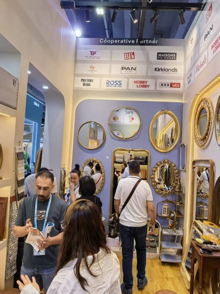 Visitors viewing ornate gold mirrors and home décor products at Teruier's booth during the 2026 Autumn Canton Fair.