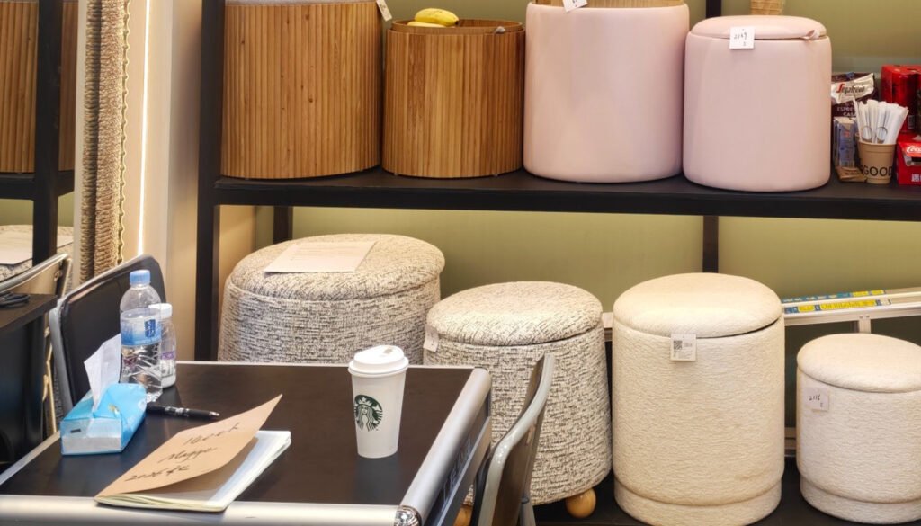 Pink and cream round upholstered accent stools with different silhouettes and soft-looking surfaces at the 2026 Canton Fair.