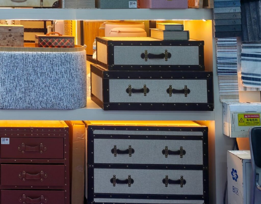 Textured storage pieces and drawer-style decorative chests presented in Teruier home décor display