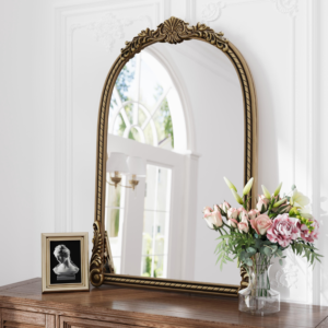 Two decorative gold wall mirror designs illustrating global home décor sourcing and retail product differentiation